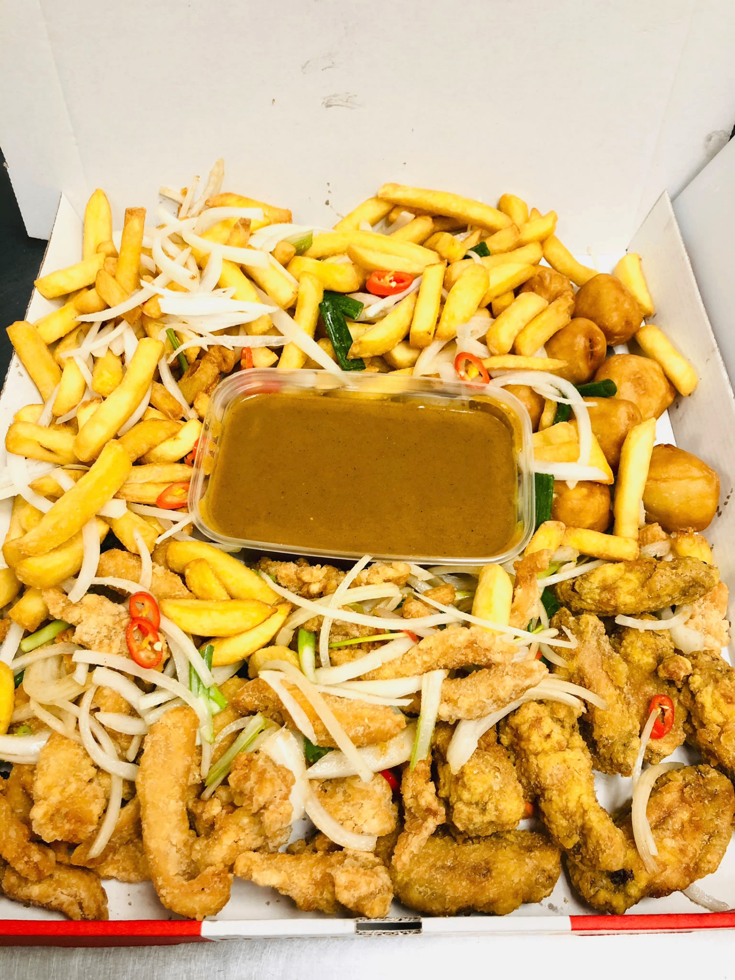 Loaded munchybox — chips, chicken, curry sauce